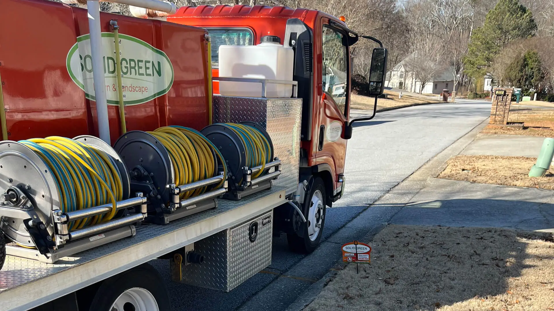 Solid Green Lawn & Landscape company truck.