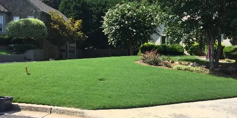 Home in Winder, GA with a Solid Green Lawn & Landscape front lawn.