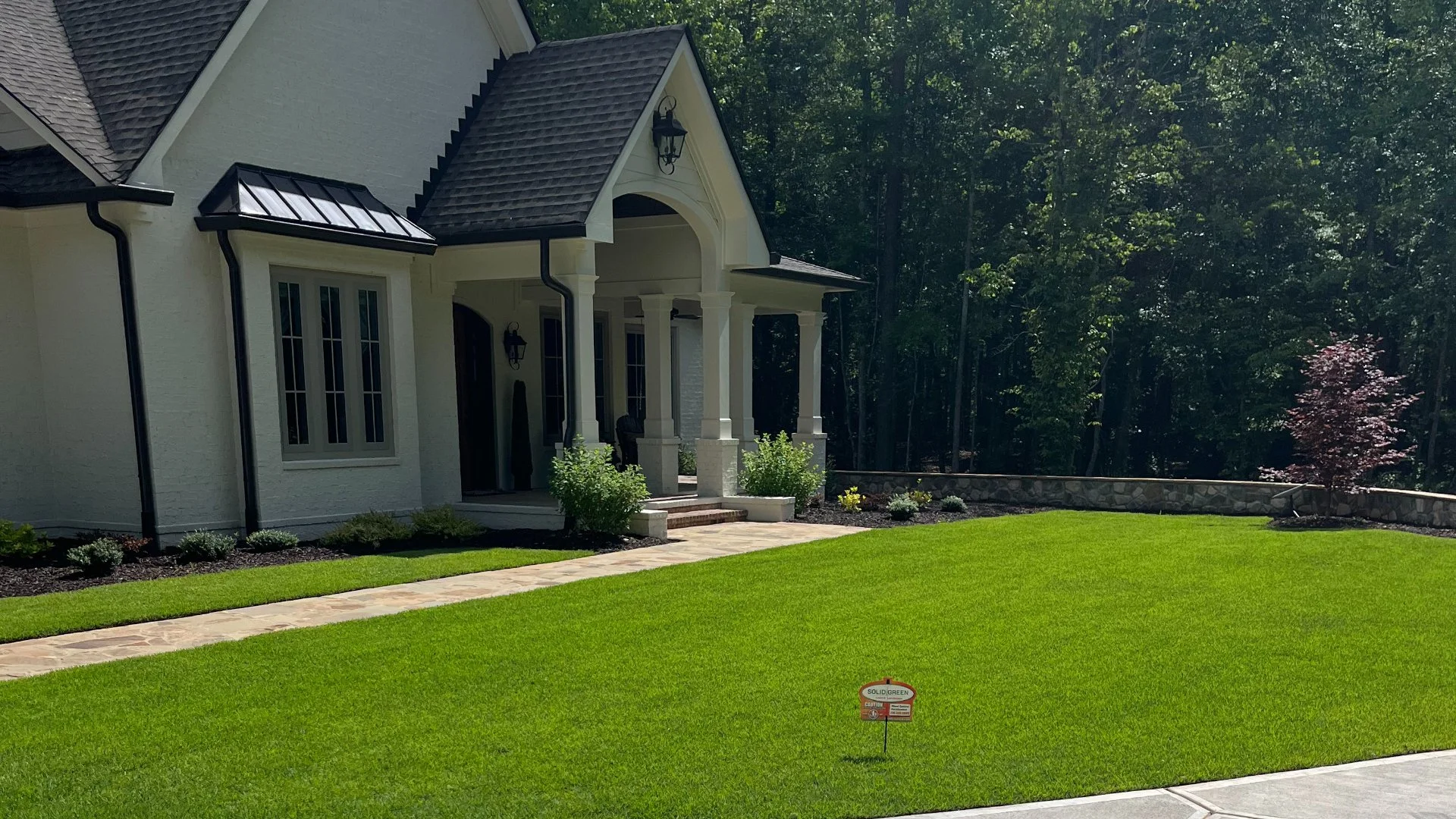 Beautiful, green, healthy lawn in front of a residential house in Northeast Georgia